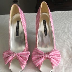 Women’s pair of pink/white checked heels.